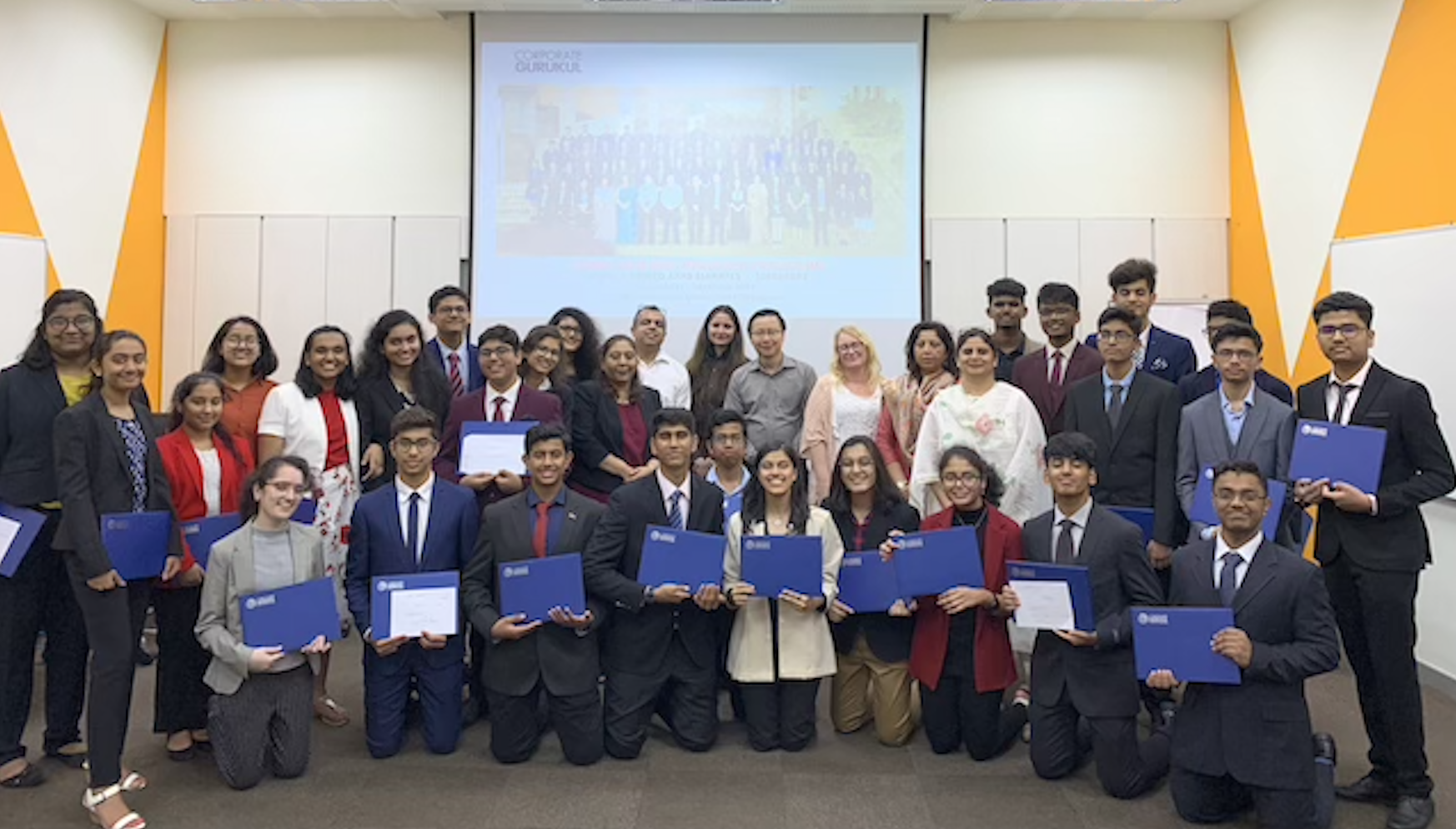 Students receiving certificates at assessment ceremony