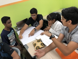 Students collaborating on learning outcomes